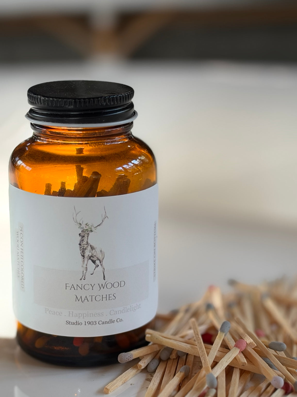 Studio 1903 Fancy Wood Matches in amber glass jar with multicolor matches