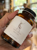 Close-up of Fancy Wood Matches label and amber glass jar