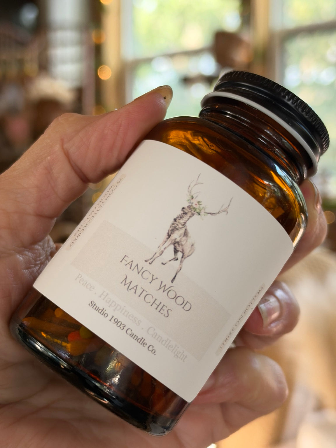 Close-up of Fancy Wood Matches label and amber glass jar