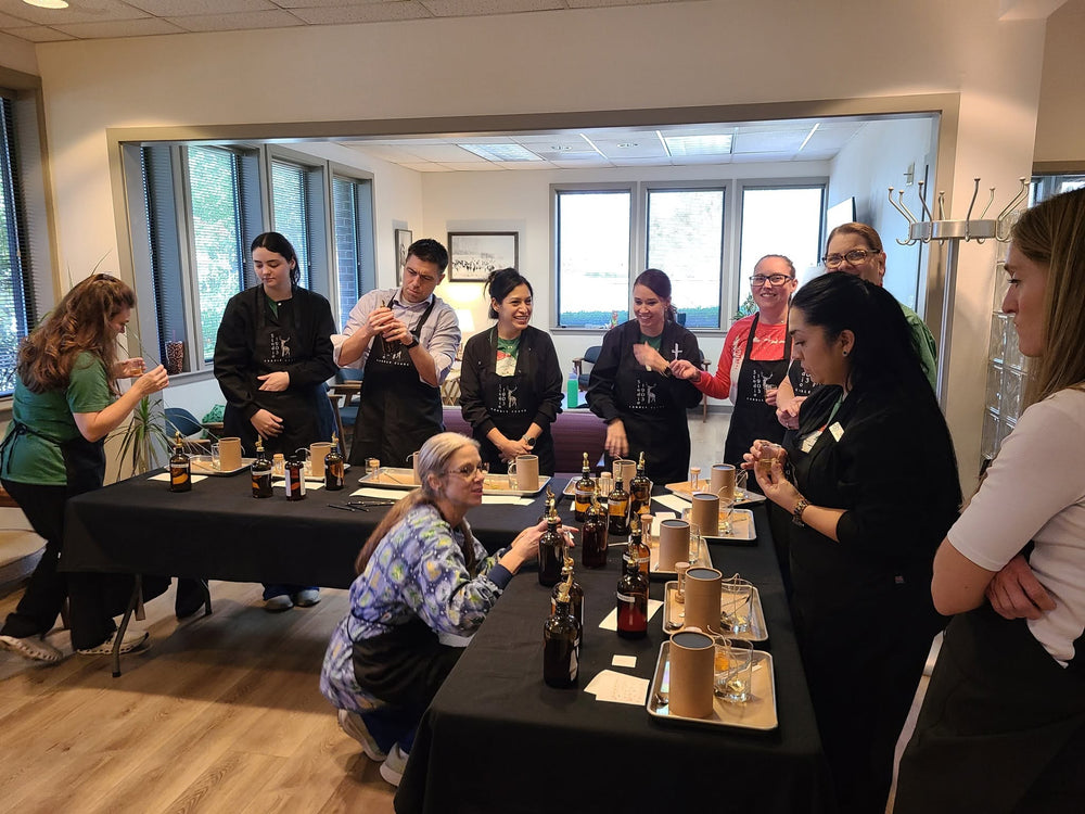 Guests selecting scents and making candles together at a team workshop